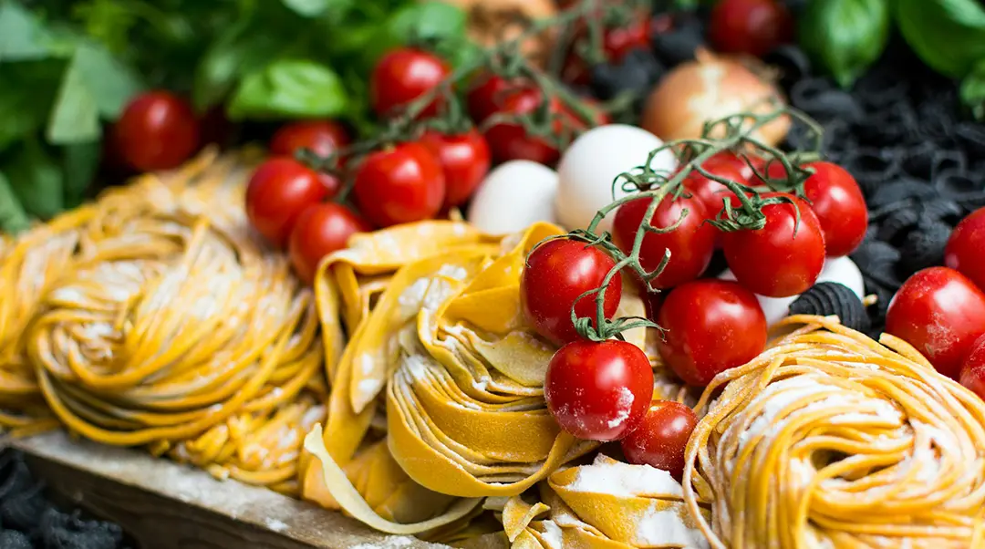 Fresh pasta, tomatoes, and basil