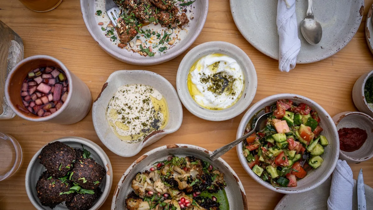 Middle Eastern mezze spread on wooden table