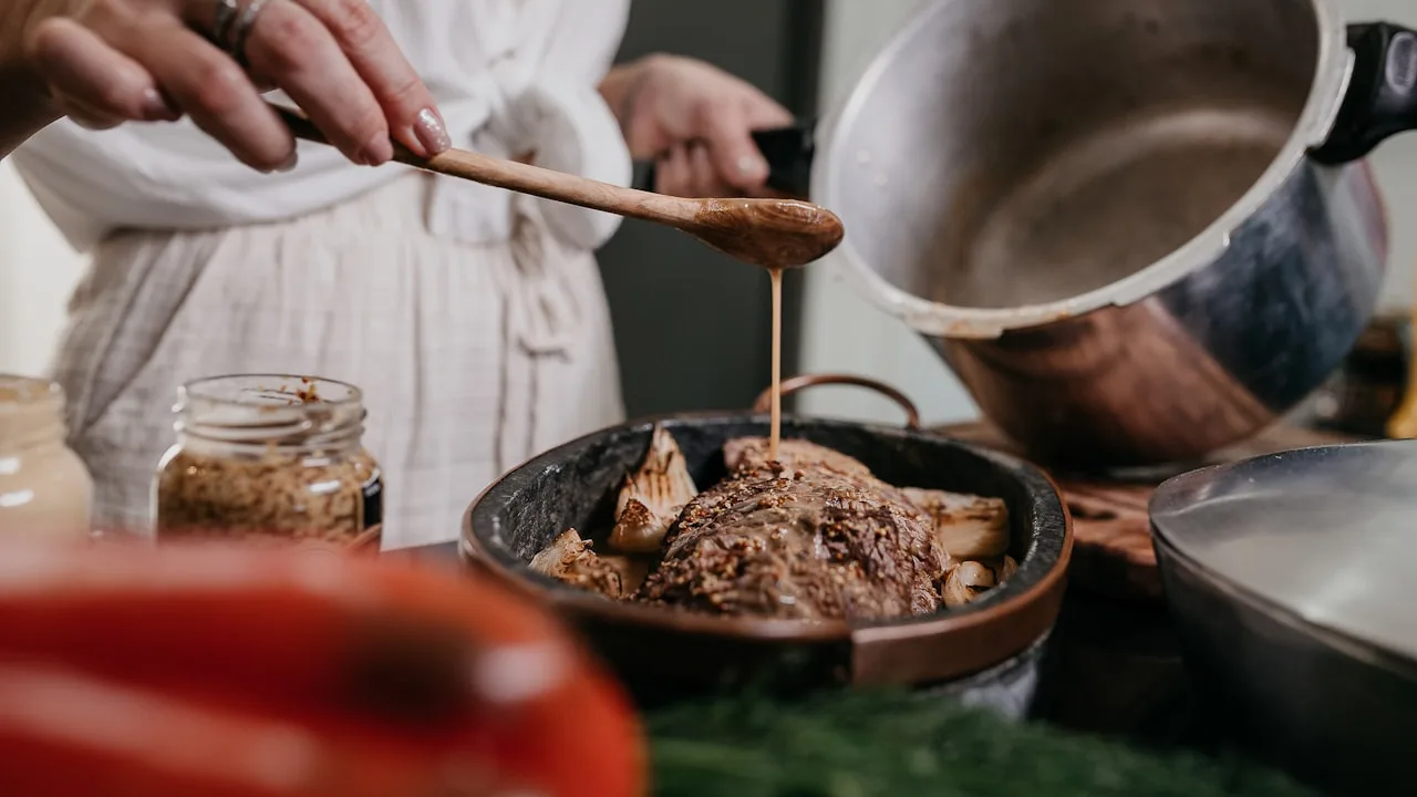 Cook drizzling sauce over roasted meat and vegetables